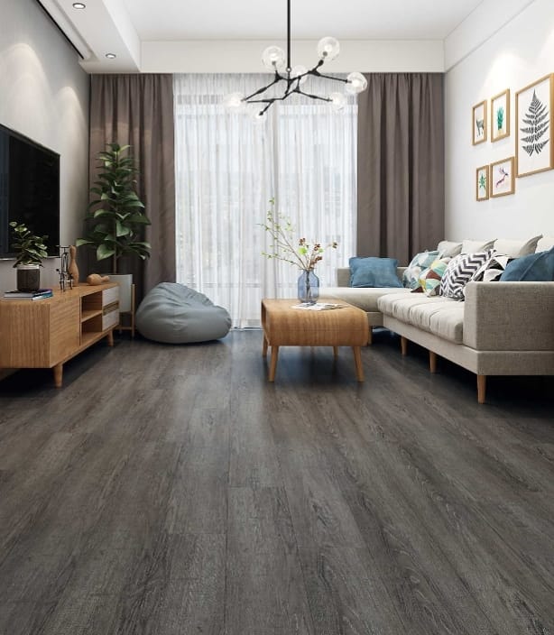 Grey plank-style flooring in a furnished living room with a sofa, TV console and floor-length curtains